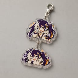 Series connection clear acrylic charms photographed on a light gray surface