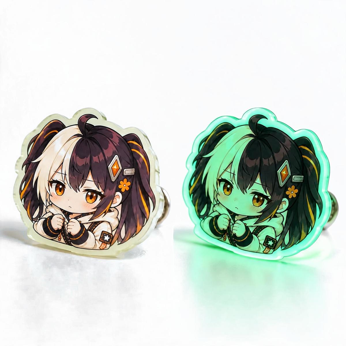 Pair of acrylic badges on black: a white cat motif in daylight and the same design glowing green in the dark